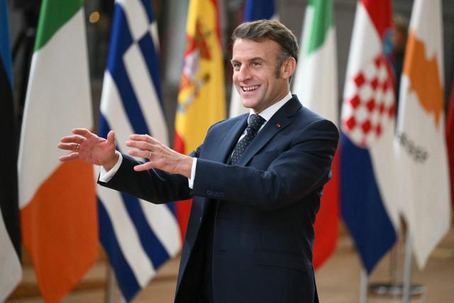 France's President Emmanuel Macron reacts as he arrives to attend the European Council meeting in Brussels on December 18, 2025. European Unions leaders meet in Brussels on December 18 and 19, 2025, to discuss in particular the need to support Ukraine, transatlantic relations and the EU's strategic autonomy. (Photo by NICOLAS TUCAT / AFP)