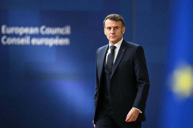 France's President Emmanuel Macron arrives to attend the European Council meeting in Brussels on December 18, 2025. European Unions leaders meet in Brussels on December 18 and 19, 2025, to discuss in particular the need to support Ukraine, transatlantic relations and the EU's strategic autonomy. (Photo by NICOLAS TUCAT / AFP)