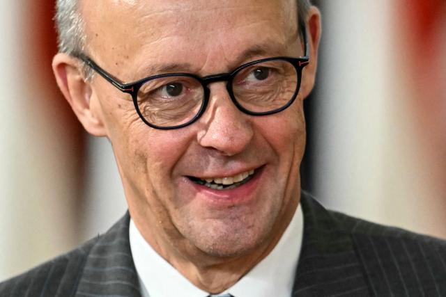 Germany's Chancellor Friedrich Merz looks on as he arrives to attend the European Council meeting in Brussels on December 18, 2025. European Unions leaders meet in Brussels on December 18 and 19, 2025, to discuss in particular the need to support Ukraine, transatlantic relations and the EU's strategic autonomy. (Photo by NICOLAS TUCAT / AFP)