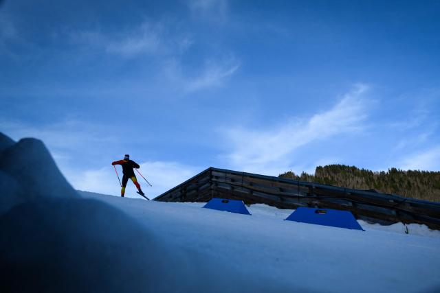 A biathlete practices during the IBU Biathlon World Cup in Le Grand Bornand near Annecy, southeastern France, on December 18, 2025. (Photo by OLIVIER CHASSIGNOLE / AFP)