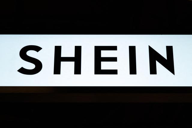 (FILES) This photograph shows the logo of Asian e-commerce giant Shein in its stall at the Bazar de l'Hotel de Ville (BHV) department store in Paris on November 4, 2025. French justice will rule on December 19 on the French government’s request for a three-month suspension of the platform of Asian online retail giant Shein, due to the illicit products it was selling, a Paris court decided on December 5. (Photo by Julie SEBADELHA / AFP)