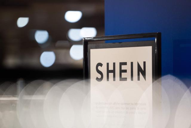 (FILES) This photograph shows the logo of Asian e-commerce giant Shein in its stall at the Bazar de l'Hotel de Ville (BHV) department store in Paris on November 4, 2025. French justice will rule on December 19 on the French government’s request for a three-month suspension of the platform of Asian online retail giant Shein, due to the illicit products it was selling, a Paris court decided on December 5. (Photo by Julie SEBADELHA / AFP)