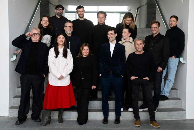 German musicians (first row, L-R) Herbert Groenemeyer, Balbina, Annett Louisan, Christopher Annen and Peter Maffay pose for a family photo with other musicians on the sidelines of a meeting with the German State Minister for Culture and Media (not in picture) to discuss the effects of music streaming at the Chancellery in Berlin on December 18, 2025. (Photo by John MACDOUGALL / POOL / AFP)