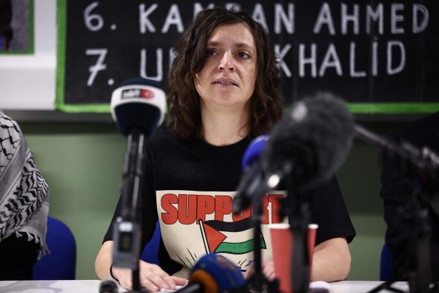 Prisoners for Palestine representative Francesca Nadin speaks during a press conference in support of hunger-striking prisoners being held on remand charged with offences related to activism on behalf of Palestine Action, in London on December 18, 2025. Supporters of the eight prisoners who are being held on remand at various prisons as they await trial for alleged break-ins or criminal damage on behalf of Palestine Action before it was proscribed as a terrorist organisation, all of whom are or have been on hunger strike, held a press conference calling on the government to intervene and consider their demands. The hunger strikers are calling for better treatment in custody, to be allowed to send and recieve mail, access books without clearance and to be bailed ahead of their trial. (Photo by HENRY NICHOLLS / AFP)