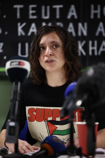 Prisoners for Palestine representative Francesca Nadin speaks during a press conference in support of hunger-striking prisoners being held on remand charged with offences related to activism on behalf of Palestine Action, in London on December 18, 2025. Supporters of the eight prisoners who are being held on remand at various prisons as they await trial for alleged break-ins or criminal damage on behalf of Palestine Action before it was proscribed as a terrorist organisation, all of whom are or have been on hunger strike, held a press conference calling on the government to intervene and consider their demands. The hunger strikers are calling for better treatment in custody, to be allowed to send and recieve mail, access books without clearance and to be bailed ahead of their trial. (Photo by HENRY NICHOLLS / AFP)