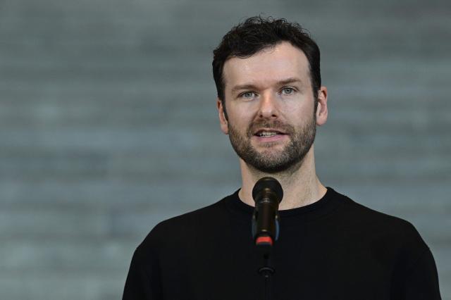 German musician Daniel Grunenberg addresses journalists following a meeting with the German State Minister for Culture (not in picture) to discuss the effects of music streaming at the Chancellery in Berlin on December 18, 2025. (Photo by John MACDOUGALL / AFP)
