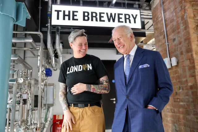 Britain's King Charles III is given a tour of the microbrewery by Master Brewer Hollie Stephenson (L) during his visit to officially open the Guinness Open Gate Brewery London on December 18, 2025. The Guinness Open Gate Brewery, a Ј73 million investment, contains a microbrewery, visitor experience, restaurants, shops, and events space, and will serve as the UK southern hub for Diageo’s award-winning Learning for Life programme. (Photo by Chris Jackson / POOL / AFP)