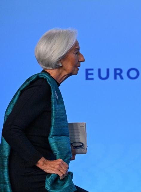 European Central Bank (ECB) President Christine Lagarde arrives for a press conference on the Eurozone's monetary policy, at the central bank's headquarters in Frankfurt am Main, western Germany, on December 18, 2025. The European Central Bank held its key interest rate steady on December 18, 2025 for a fourth straight meeting and said it expected inflation to stabilise around its two-percent target "in the medium term". (Photo by Kirill KUDRYAVTSEV / AFP) / ALTERNATIVE CROP