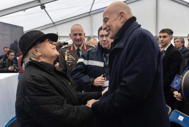 France's Defence Minister Catherine Vautrin (L) talks to Greece's Minister of National Defence Nikos Dendias (R) during the delivery ceremony of the Defence and Intervention frigate HS Kimon to the Greek Navy in Lorient, western France, on December 18, 2025. (Photo by Fred TANNEAU / AFP)
