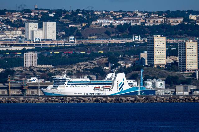 This photograph taken on December 18, 2025 shows a ship belonging to the shipping company "La Meridionale" moored in the port of Marseille, southern France. (Photo by MIGUEL MEDINA / AFP)