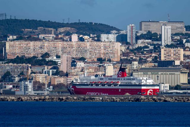 This photograph taken on December 18, 2025 shows a ship belonging to the shipping company "Corsica Linea" moored in the port of Marseille, southern France. (Photo by MIGUEL MEDINA / AFP)