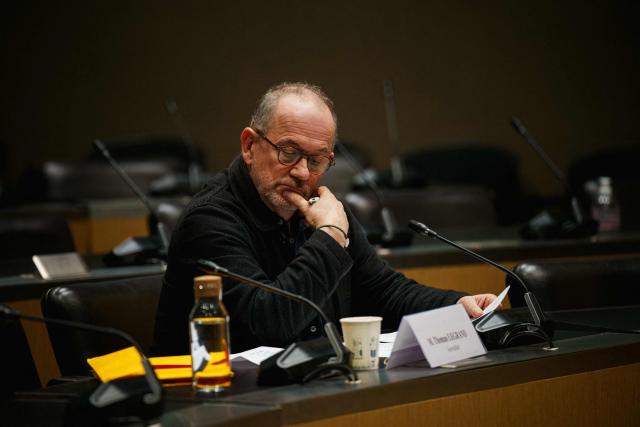 French journalist Thomas Legrand looks on prior to the start of a hearing before the Public Audiovisual Committee of Inquiry at the National Assembly building, France's Parliament lower house, in Paris on December 18, 2025. (Photo by Dimitar DILKOFF / AFP)