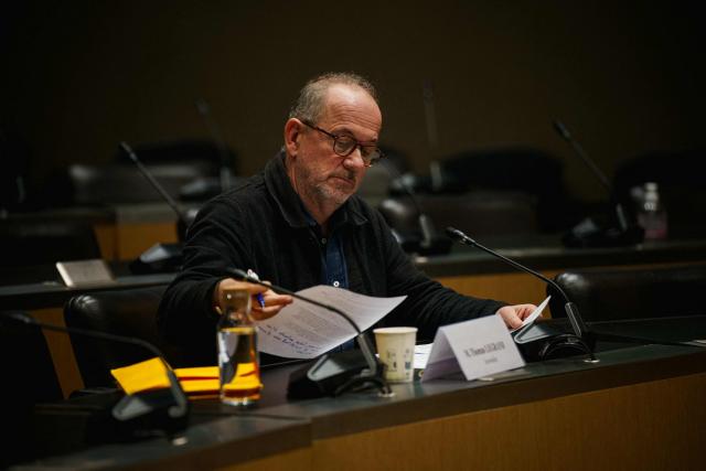 French journalist Thomas Legrand looks on prior to the start of a hearing before the Public Audiovisual Committee of Inquiry at the National Assembly building, France's Parliament lower house, in Paris on December 18, 2025. (Photo by Dimitar DILKOFF / AFP)