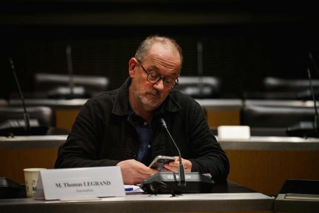 French journalist Thomas Legrand looks on prior to the start of a hearing before the Public Audiovisual Committee of Inquiry at the National Assembly building, France's Parliament lower house, in Paris on December 18, 2025. (Photo by Dimitar DILKOFF / AFP)