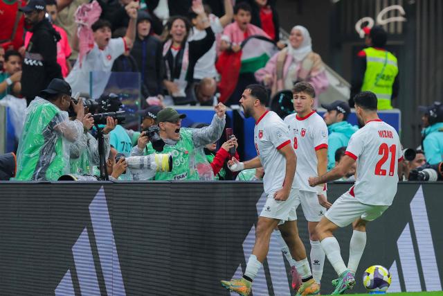 Jordan's forward #9 Ali Olwan celebrates scoring his team's first goal during the FIFA Arab Cup 2025 final football match between Jordan and Morocco at the Lusail Stadium  Stadium, in Lusail on December 18, 2025. (Photo by Karim JAAFAR / AFP)