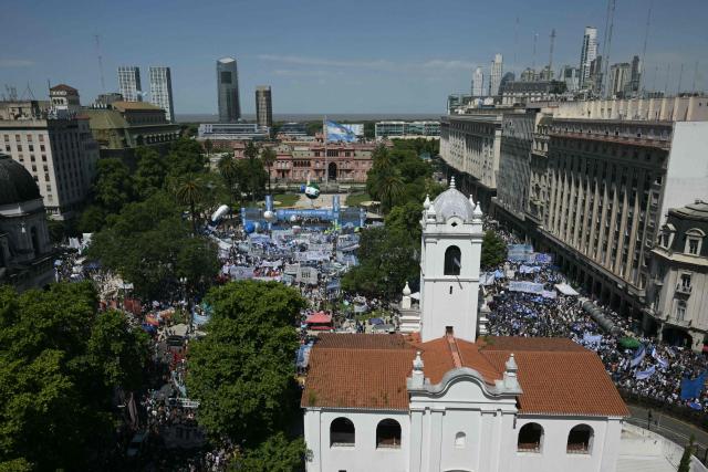 This view shows a protest organized by Argentine unions at Plaza de Mayo in Buenos Aires on December 18, 2025. People protested on December 18, against the labor reform promoted by Argentina’s ultraliberal President Javier Milei, in a demonstration called by the country’s main labor union. It was the first protest against the initiative, held outside the government palace in Buenos Aires. (Photo by Juan Mabromata / AFP)