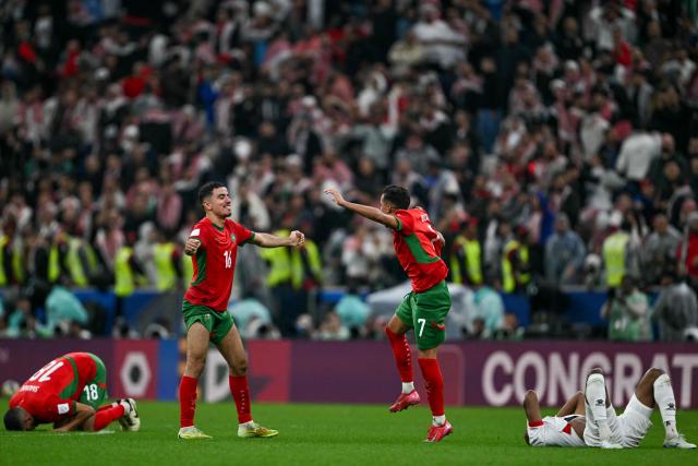 Morocco's players celebrate after winning the FIFA Arab Cup 2025 final football match between Jordan and Morocco at the Lusail Stadium  Stadium, in Lusail on December 18, 2025. (Photo by Mahmud HAMS / AFP)