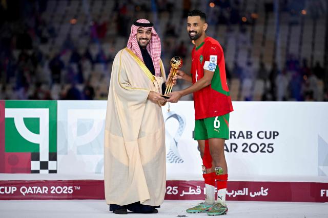 Morocco's midfielder #6 Mohamed Rabie Hrimat receives his Player of the Tournament award after the FIFA Arab Cup 2025 final football match between Jordan and Morocco at the Lusail Stadium  Stadium, in Lusail on December 18, 2025. (Photo by Mahmud HAMS / AFP)