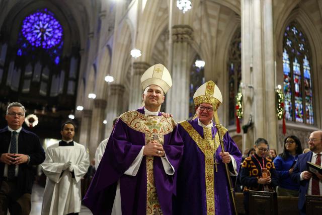 Cardinal Timothy Dolan (R) and his successor Ronald Hicks arrive to lead a mass at St. Patrick's Cathedral in the Manhattan borough of New York City on December 18, 2025. Pope Leo XIV has accepted the resignation of New York's conservative Archbishop Timothy Dolan and named a little-known, pro-migrant bishop from his native Chicago to replace him, the Vatican said on December 18. (Photo by CHARLY TRIBALLEAU / AFP)