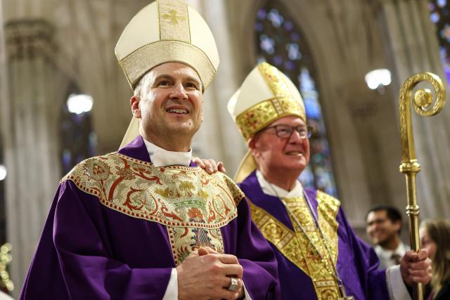 Cardinal Timothy Dolan (R) and his successor Ronald Hicks arrive to lead a mass at St. Patrick's Cathedral in the Manhattan borough of New York City on December 18, 2025. Pope Leo XIV has accepted the resignation of New York's conservative Archbishop Timothy Dolan and named a little-known, pro-migrant bishop from his native Chicago to replace him, the Vatican said on December 18. (Photo by CHARLY TRIBALLEAU / AFP)