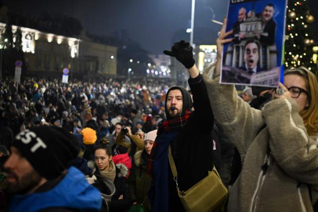 Protesters shout slogans as thousands gather to take part in an anti-government demonstration in Sofia on December 18, 2025. (Photo by Nikolay DOYCHINOV / AFP)