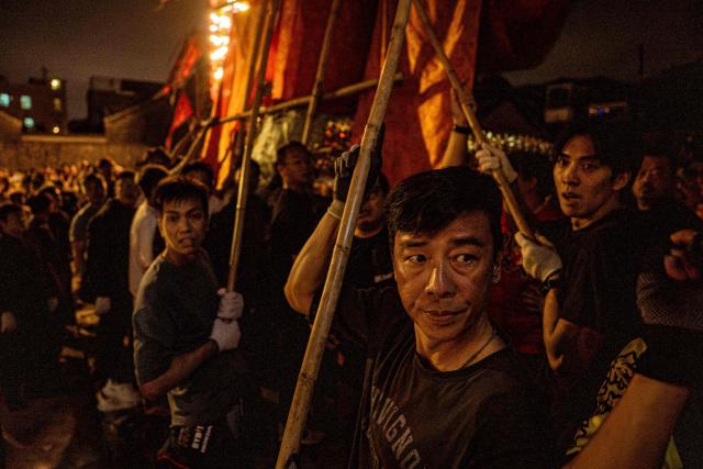 The paper effigy of the Ghost King is paraded during the decennial Jiao Festival of Kam Tin in Hong Kong on December 18, 2025. The Taoist ritual, held once every ten years, is performed to give thanks to deities, ward off misfortune and pray for peace and prosperity in the community. (Photo by Leung Man Hei / AFP)