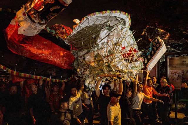 The paper effigy of the Ghost King is paraded during the decennial Jiao Festival of Kam Tin in Hong Kong on December 18, 2025. The Taoist ritual, held once every ten years, is performed to give thanks to deities, ward off misfortune and pray for peace and prosperity in the community. (Photo by Leung Man Hei / AFP)