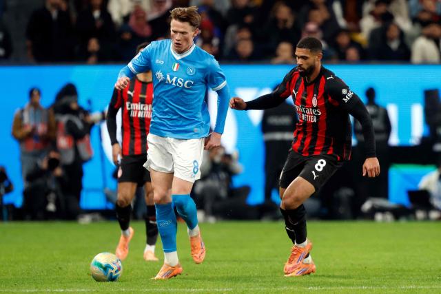 AC Milan's #8 Ruben Loftus-Cheek (R) and SCC Napoli's #8 Scott Mctominay fight for the ball during the Italian Super Cup semi-final match between SCC Napoli and AC Milan at King Saud University Stadium in Riyadh on December 18, 2025. (Photo by Fayez Nureldine / AFP)
