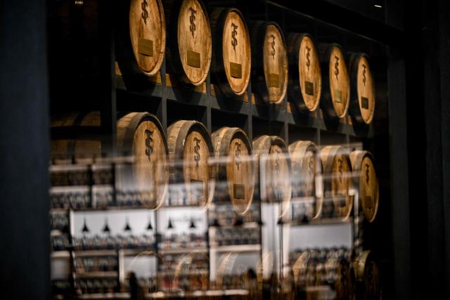 Rum barrels are stored in the private cellars of Venezuelan rum producer Santa Teresa in La Victoria, Aragua state, Venezuela, on December 17, 2025. (Photo by Federico PARRA / AFP)