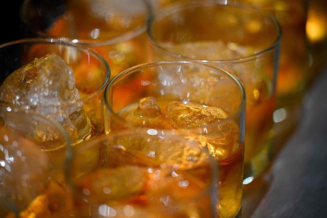 Glasses of rum are seen during an event by Hacienda Santa Teresa rum producer in Caracas on December 13, 2025. (Photo by Federico PARRA / AFP)