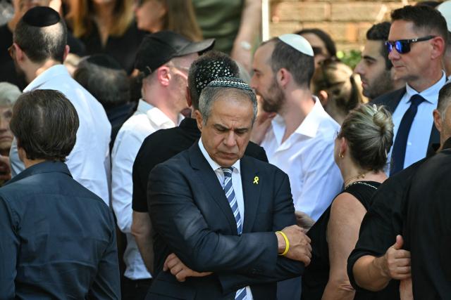 Israel's Ambassador to Australia Amir Maimon reacts after the funeral of Boris and Sofia Gurman, who were killed in the December 14 Bondi Beach shooting attack, at the Sydney Chevra Kadisha in Sydney on December 19, 2025. Father-and-son gunmen are accused of firing into crowds at a beachside Jewish festival on December 14, killing 15 in an attack authorities linked to "Islamic State ideology". (Photo by Saeed KHAN / AFP)
