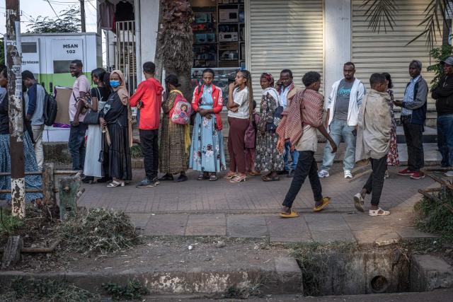 A group of people wait in a long line for public transportation along a main street in Bahir Dar on December 9, 2025. Northern Amhara is Ethiopia's second most populated region with roughly 23 million inhabitants, and has endured nearly three years of conflict between the federal army and the "Fano," Amhara's self-defence militias.
The present conflict stems from the 2020-2022 Tigray War, which killed more than 600,000 people, according to the African Union.
The Fano, like many in Amhara, felt betrayed by the November 2022 peace deal after their support to the government against the neighbouring Tigrayan forces.
It came to a head in April 2023, when an attempt by the federal government to disarm the Fano and Amhara forces ignited the conflict. (Photo by Marco Simoncelli / AFP)
