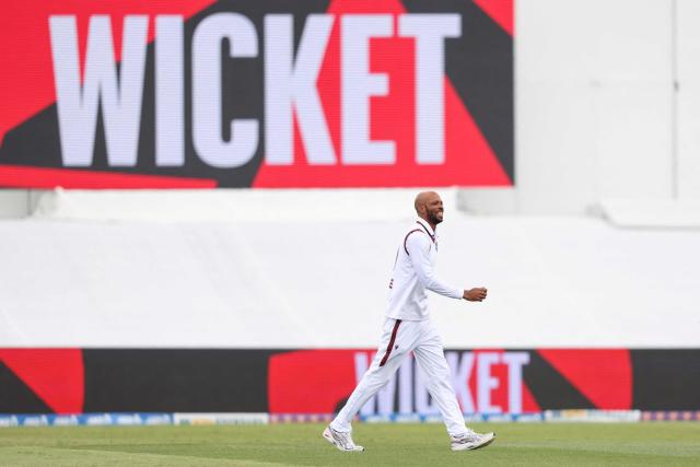 West Indies' Roston Chase celebrates the wicket of New Zealand’s Daryl Mitchell during day two of the 3rd international Test cricket match between New Zealand and West Indies at Bay Oval in Mount Maunganui on December 19, 2025. (Photo by Michael Bradley / AFP)