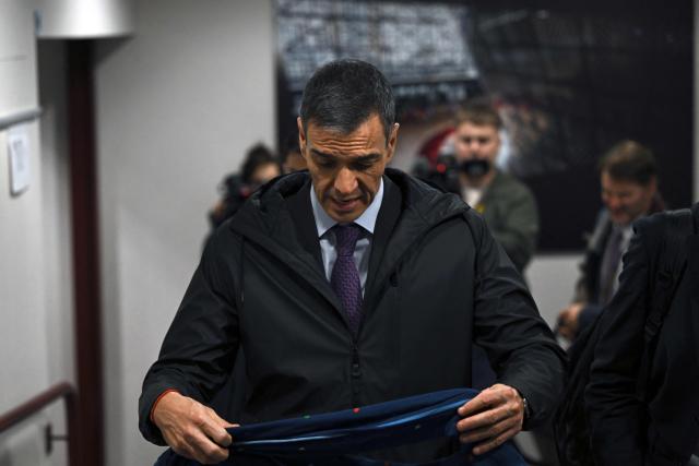 Spain's Prime Minister Pedro Sanchez leaves at the end of the European Council meeting in Brussels, Belgium on December 19, 2025. (Photo by Nicolas TUCAT / AFP)