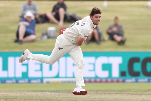 New Zealand’s Zak Foulkes bowls during day two of the 3rd international Test cricket match between New Zealand and West Indies at Bay Oval in Mount Maunganui on December 19, 2025. (Photo by Michael Bradley / AFP)
