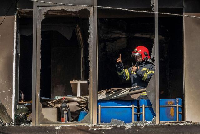 A firefighter works inside the burnt and vandalised building of the Prothom Alo newspaper in Dhaka on December 19, 2025, amid protests following the news of the death of youth leader Sharif Osman Hadi. Violence broke out in Bangladesh's capital early on December 19 after a youth leader of the country's 2024 pro-democracy uprising who was injured in an assassination attempt died in a hospital in Singapore. Several buildings in the capital, including those housing the country's two leading newspapers, were set on fire, according to authorities, with staff trapped inside. (Photo by Abdul Goni / AFP)