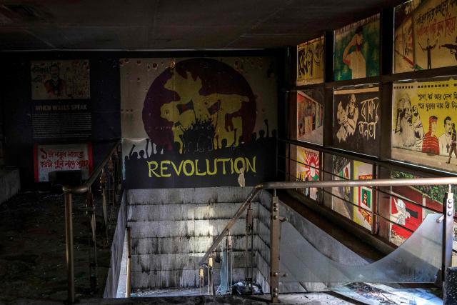 Photographs and artworks are seen inside the burnt office of The Daily Star newspaper in Dhaka on December 19, 2025, amid protests following the news of the death of youth leader Sharif Osman Hadi. Violence broke out in Bangladesh's capital early on December 19 after a youth leader of the country's 2024 pro-democracy uprising who was injured in an assassination attempt died in a hospital in Singapore. Several buildings in the capital, including those housing the country's two leading newspapers, were set on fire, according to authorities, with staff trapped inside. (Photo by Abdul Goni / AFP)