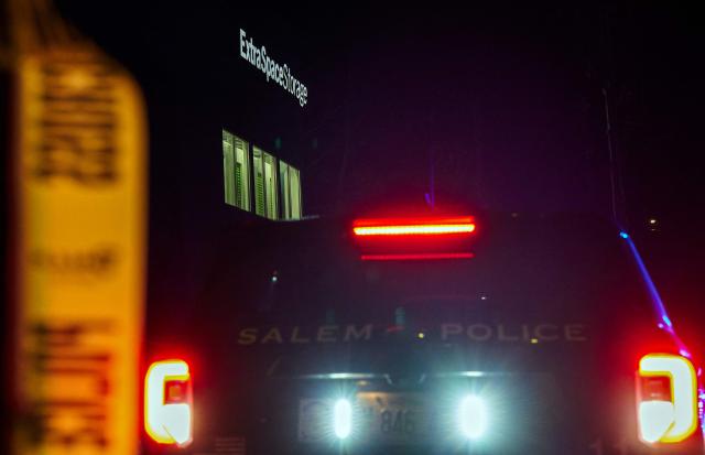 A Salem Police Department cruiser is parked outside the storage facility where the suspect behind the mass shooting at Brown University was found dead, in Salem, New Hampshire, on December 19, 2025. A man believed to be behind both a mass shooting at Brown University and the killing of an MIT professor has been found dead after a days-long manhunt, authorities said Thursday. The suspect, Claudio Neves Valente, was a 48-year-old Portuguese national who had once studied physics at Brown, officials announced at press conferences in Providence and Boston. (Photo by Bing Guan / AFP)