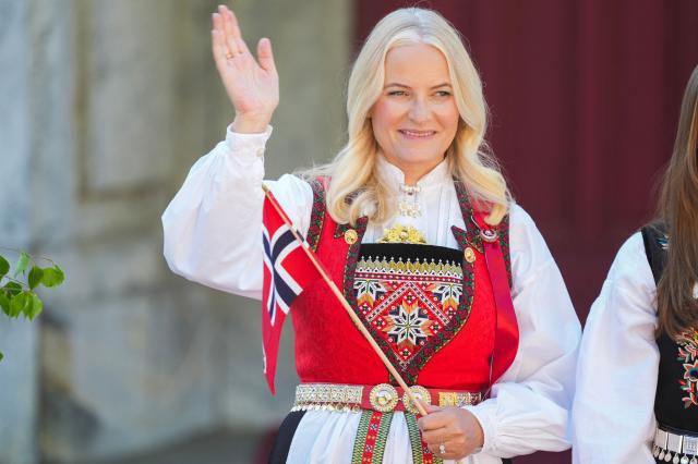 (FILES) Crown Princess Mette-Marit of Norway greets the children's parade during the May 17 celebrations at the Royal residence, Skaugum, west of the Norwegian capital Oslo, on May 17, 2024. Norway's 52-year-old Crown Princess Mette-Marit, who suffers from a chronic lung condition, will likely need to undergo a lung transplant following a "clear deterioration", the palace said on December 19, 2025. The princess announced in October 2018 that she had been diagnosed with a rare form of pulmonary fibrosis, an incurable disease that causes scarring of the lungs and shortness of breath. (Photo by Lise Åserud / NTB / AFP) / Norway OUT