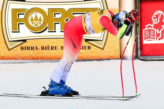 Switzerland's Marco Odermatt reacts crossing the finish line of the men's Super G race during the FIS Alpine Ski World Cup, in Val Gardena, on December 19, 2025. (Photo by Stefano RELLANDINI / AFP)