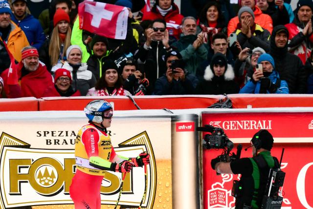 Switzerland's Marco Odermatt reacts crossing the finish line of the men's Super G race during the FIS Alpine Ski World Cup, in Val Gardena, on December 19, 2025. (Photo by Stefano RELLANDINI / AFP)