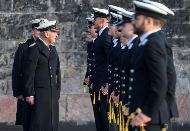 Britain's King Charles III in his role of Lord High Admiral inspects the guard during the Lord High Admiral's Parade at Britannia Royal Naval College in Dartmouth, south west England on December 19, 2025. inspects the Guard (Photo by Chris Jackson / POOL / AFP)