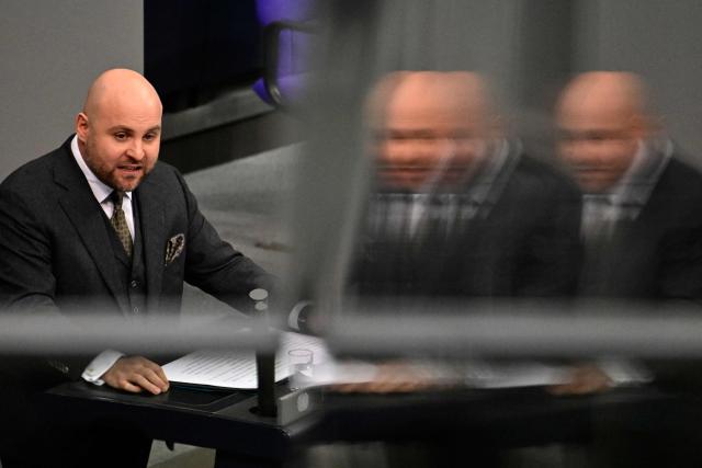 Markus Frohnmaier, parliamentary group vice-leader of the far-right Alternative for Germany (AfD) party, speaks during a debate at the Bundestag (lower house of parliament), on December 19, 2025 in Berlin. (Photo by John MACDOUGALL / AFP)