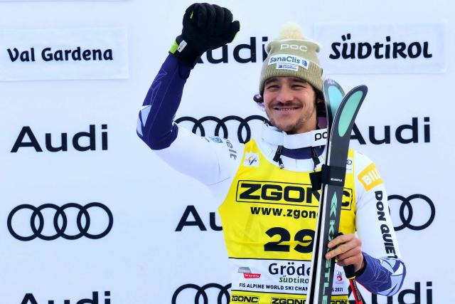 TOPSHOT - Czech Republic's Jan Zabystran celebrates on the podium after winning the FIS Alpine Skiing men's World Cup Super G in Val Gardena on December 19, 2025. (Photo by Stefano RELLANDINI / AFP)