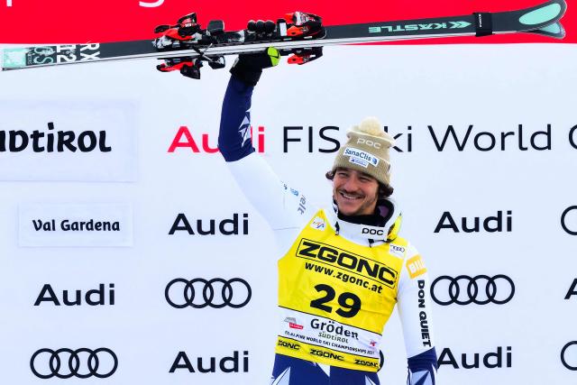 Czech Republic's Jan Zabystran celebrates on the podium after winning the FIS Alpine Skiing men's World Cup Super G in Val Gardena on December 19, 2025. (Photo by Stefano RELLANDINI / AFP)
