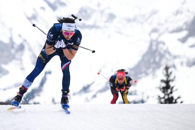 France's Eric Perrot (L) competes during the men's 10km sprint event of the IBU Biathlon World Cup, in Le Grand Bornand, near Annecy, southeastern France, on December 19, 2025. (Photo by Olivier CHASSIGNOLE / AFP)