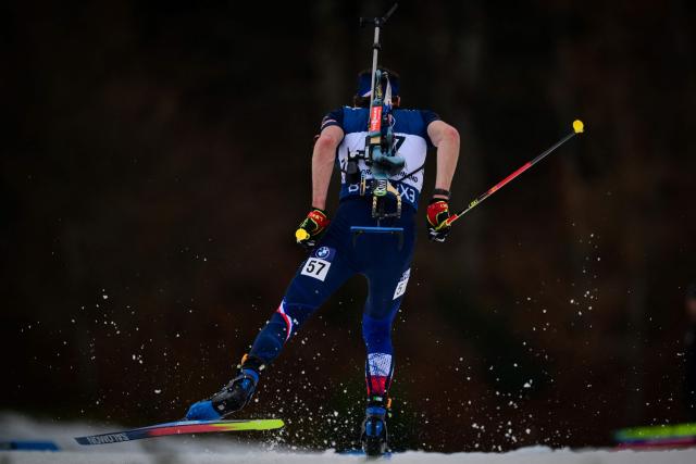 France's Valentin Lejeune competes during the men's 10km sprint event of the IBU Biathlon World Cup, in Le Grand Bornand, near Annecy, southeastern France, on December 19, 2025. (Photo by Olivier CHASSIGNOLE / AFP)