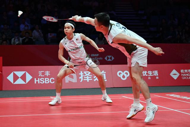 Malaysia’s Aaron Chia and Soh Wooi Yik play a point during their men’s doubles match against India’s Satwiksairaj Rankireddy and Chirag Shetty at the BWF Badminton World Tour Finals at the Hangzhou Olympic Sports Centre Gymnasium in Hangzhou, in eastern China's Zhejiang province on December 19, 2025. (Photo by Jade Gao / AFP)