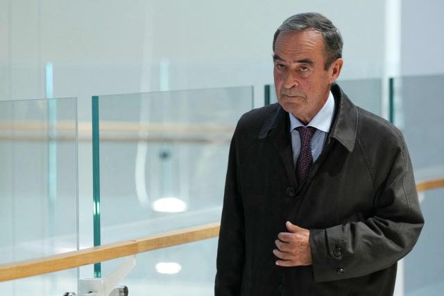 (FILES) Former Director General of Lafarge Bruno Lafont arrives on the opening day of the trial of the French cement group Lafarge and eight individuals, including former executives, accused of financing terrorism in Syria, at the Paris courthouse, in Paris, on November 4, 2025. The Paris Correctional Court will deliver its verdict on April 13, 2026 in the trial for terrorism financing involving the company Lafarge and eight former executives, suspected of having paid jihadist groups classified as "terrorist" in Syria until 2014 to keep a cement plant operating there. (Photo by Dimitar DILKOFF / AFP)
