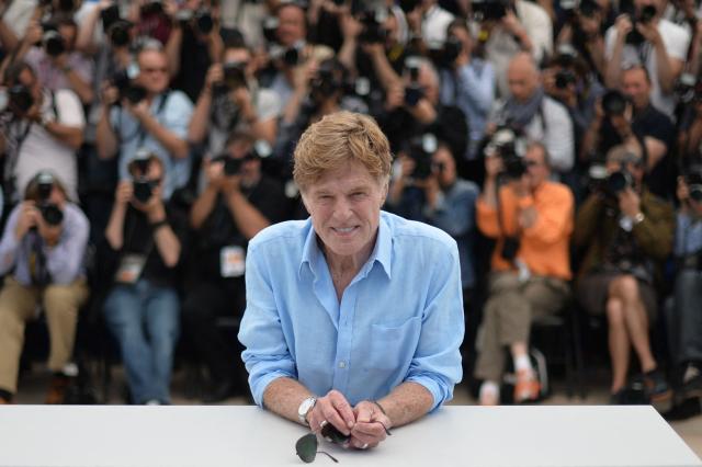 (FILES) US actor and director Robert Redford poses on May 22, 2013 during a photocall for the film "All is Lost" presented Out of Competition at the 66th edition of the Cannes Film Festival in Cannes. Cannes, one of the world's top film festivals, opened on May 15 and will climax on May 26 with awards selected by a jury headed this year by Hollywood legend Steven Spielberg. AFP PHOTO / ALBERTO PIZZOLI (Photo by Alberto PIZZOLI / AFP)